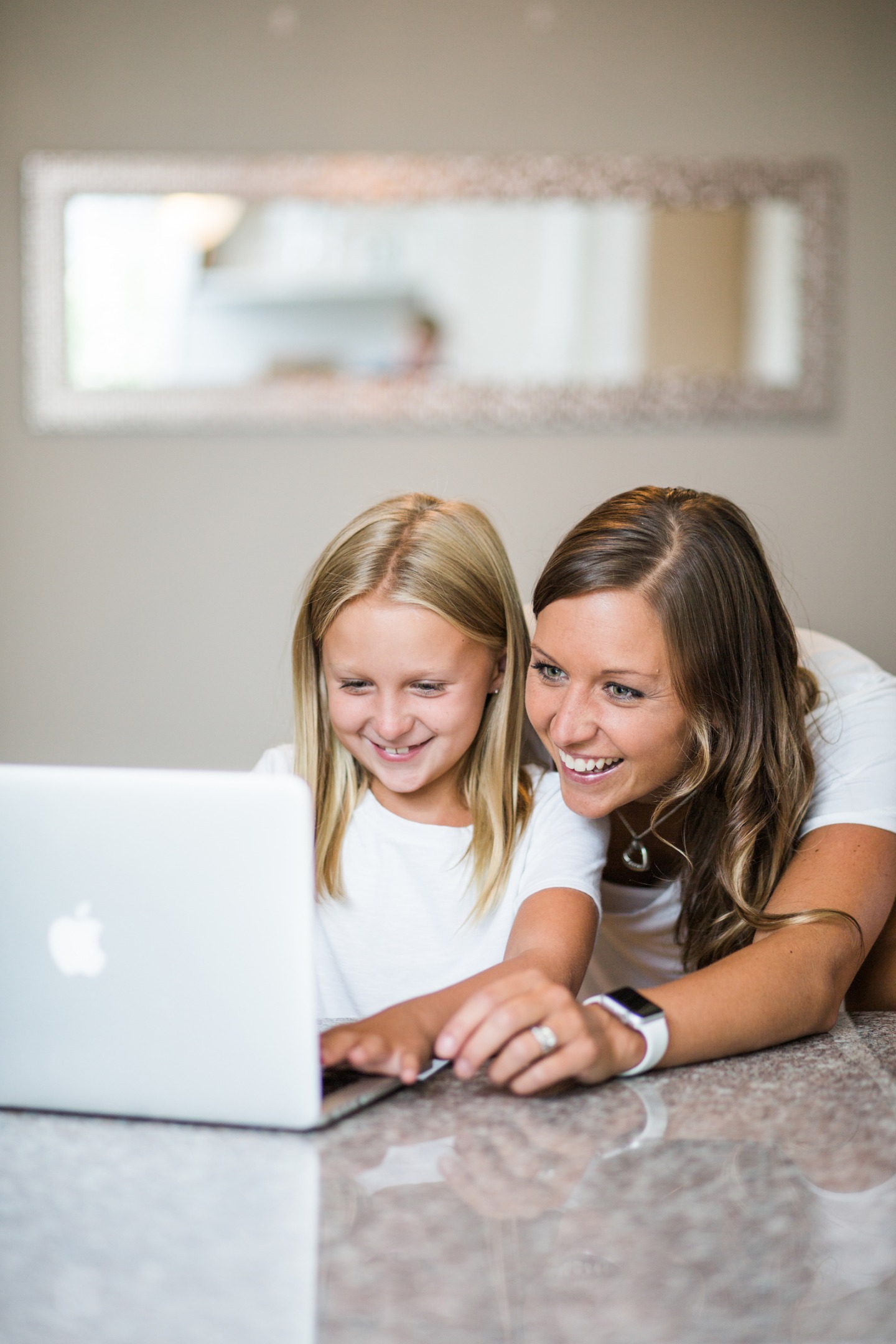 A student and parent on laptop reviewing LUOA policies