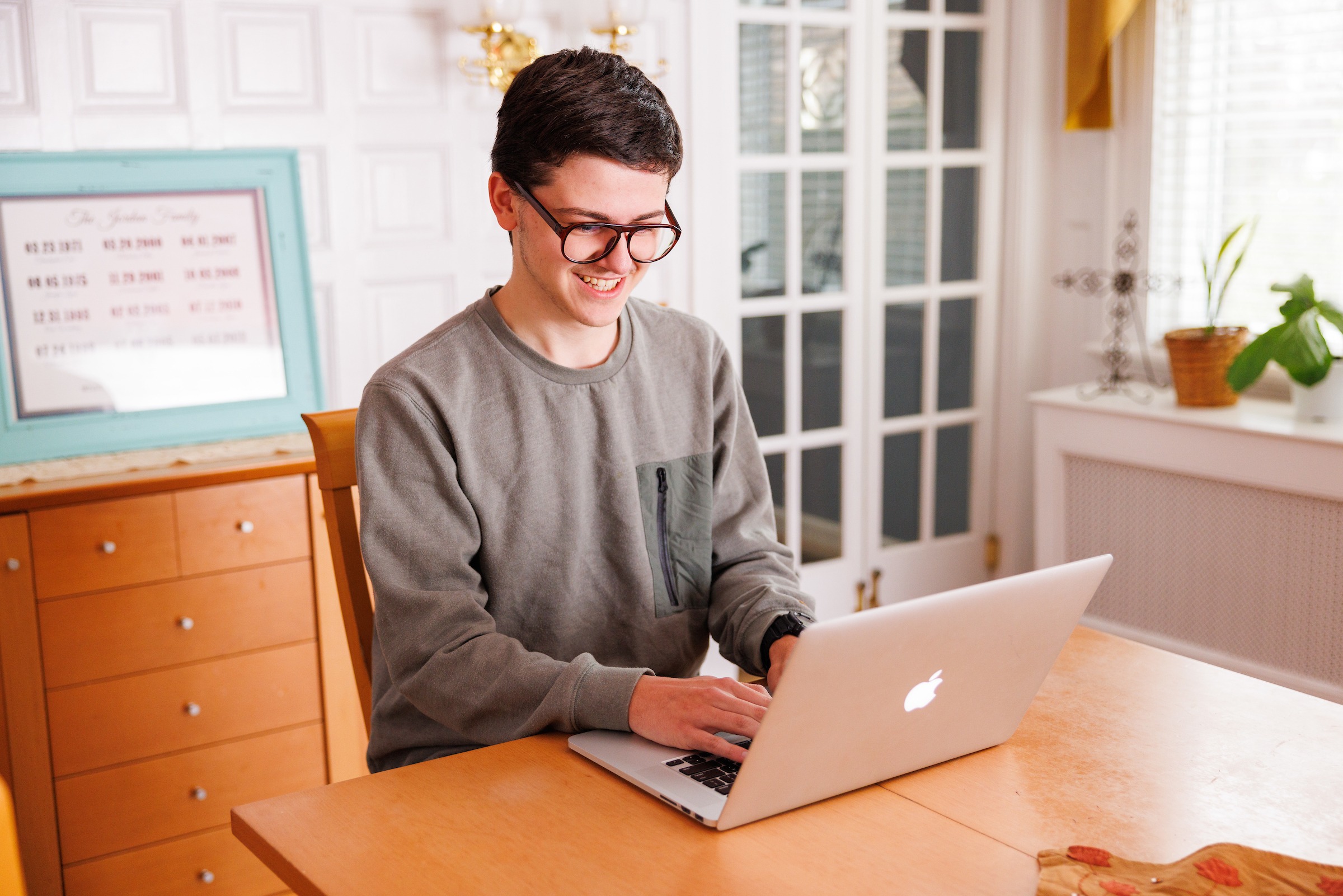 High school student studying on computer at home for LUOA Affiliate program