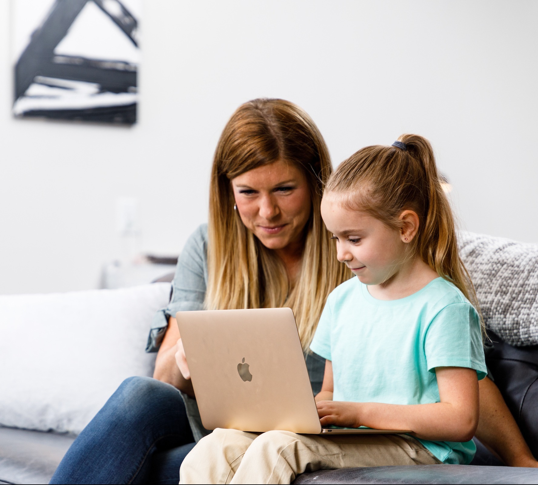 LUOA student and parent looking at the digital brochure on laptop