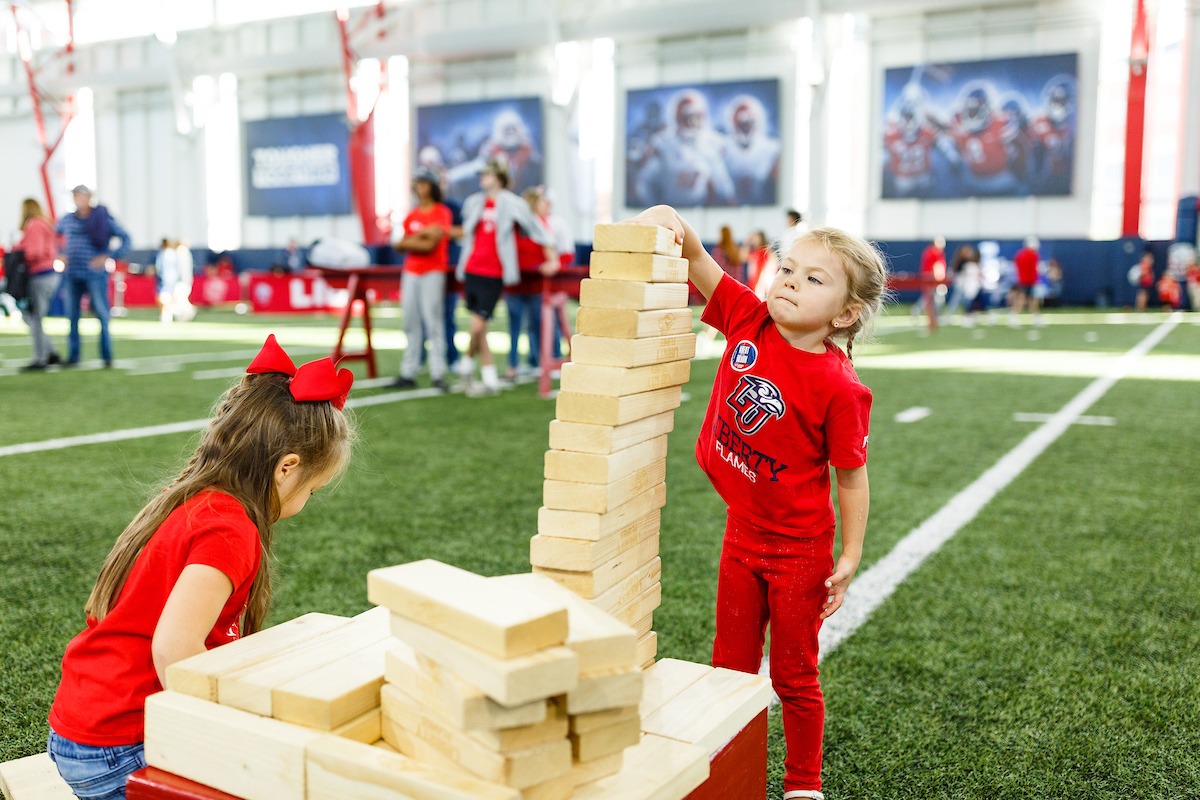 Families participating in activities at the LUOA tailgate