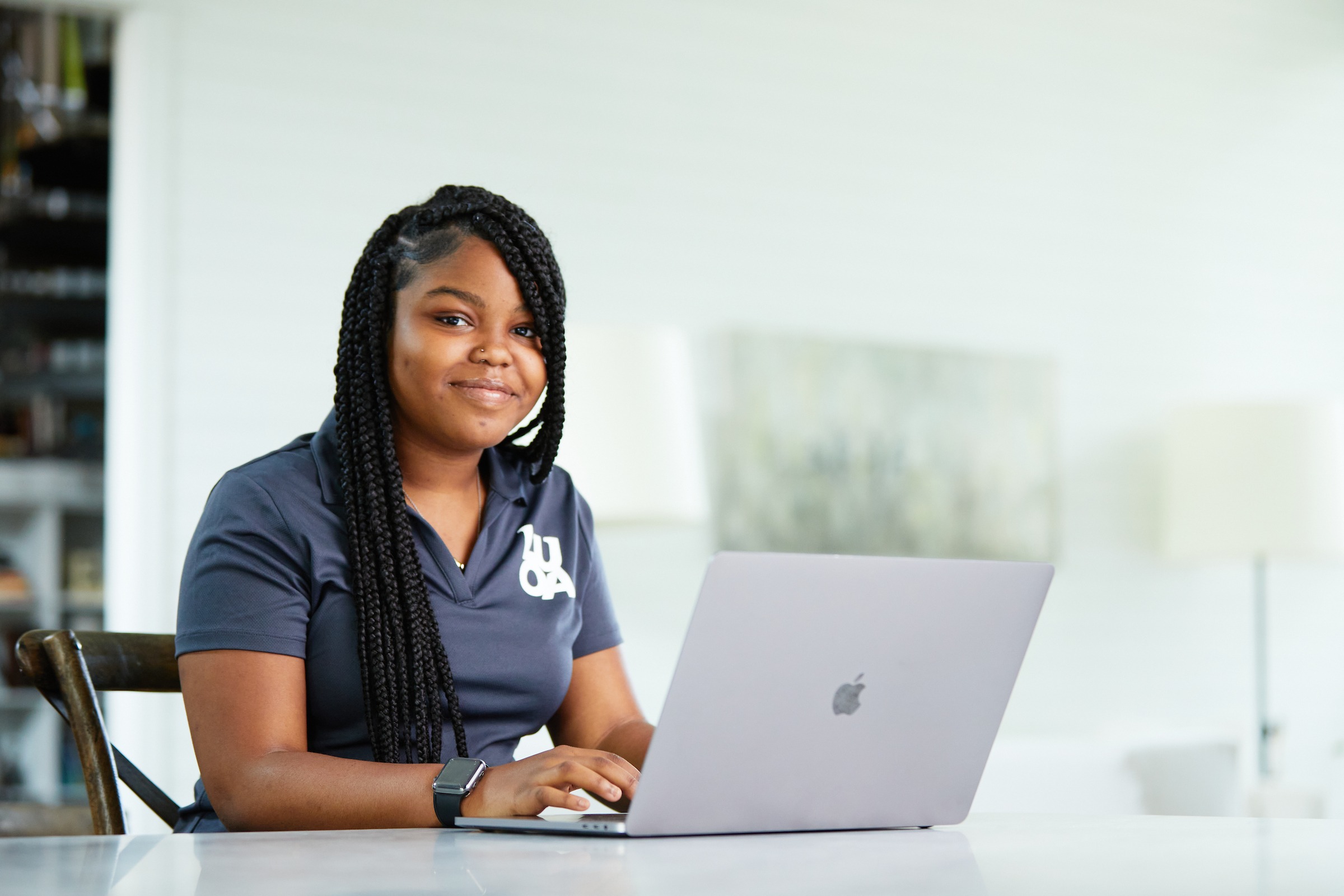 High school LUOA student working from home on laptop