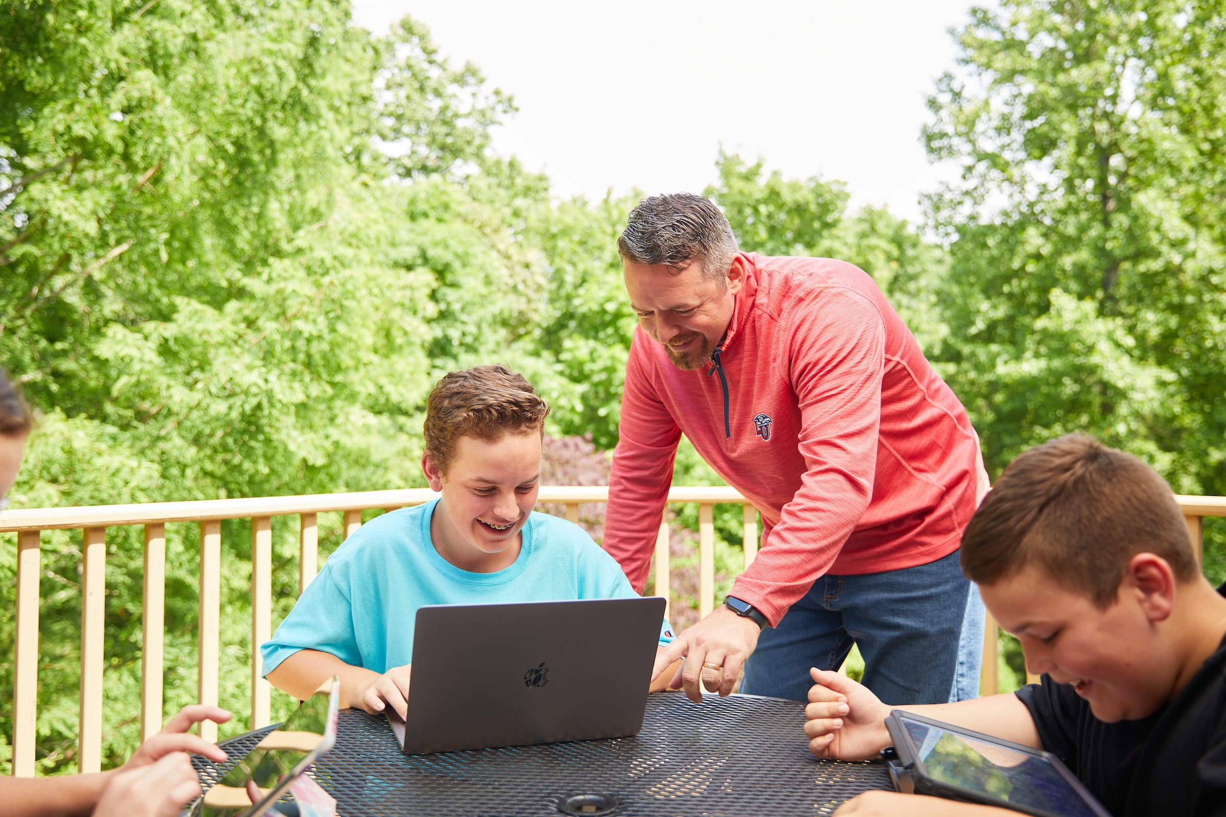 LUOA students and dad working outside on courses