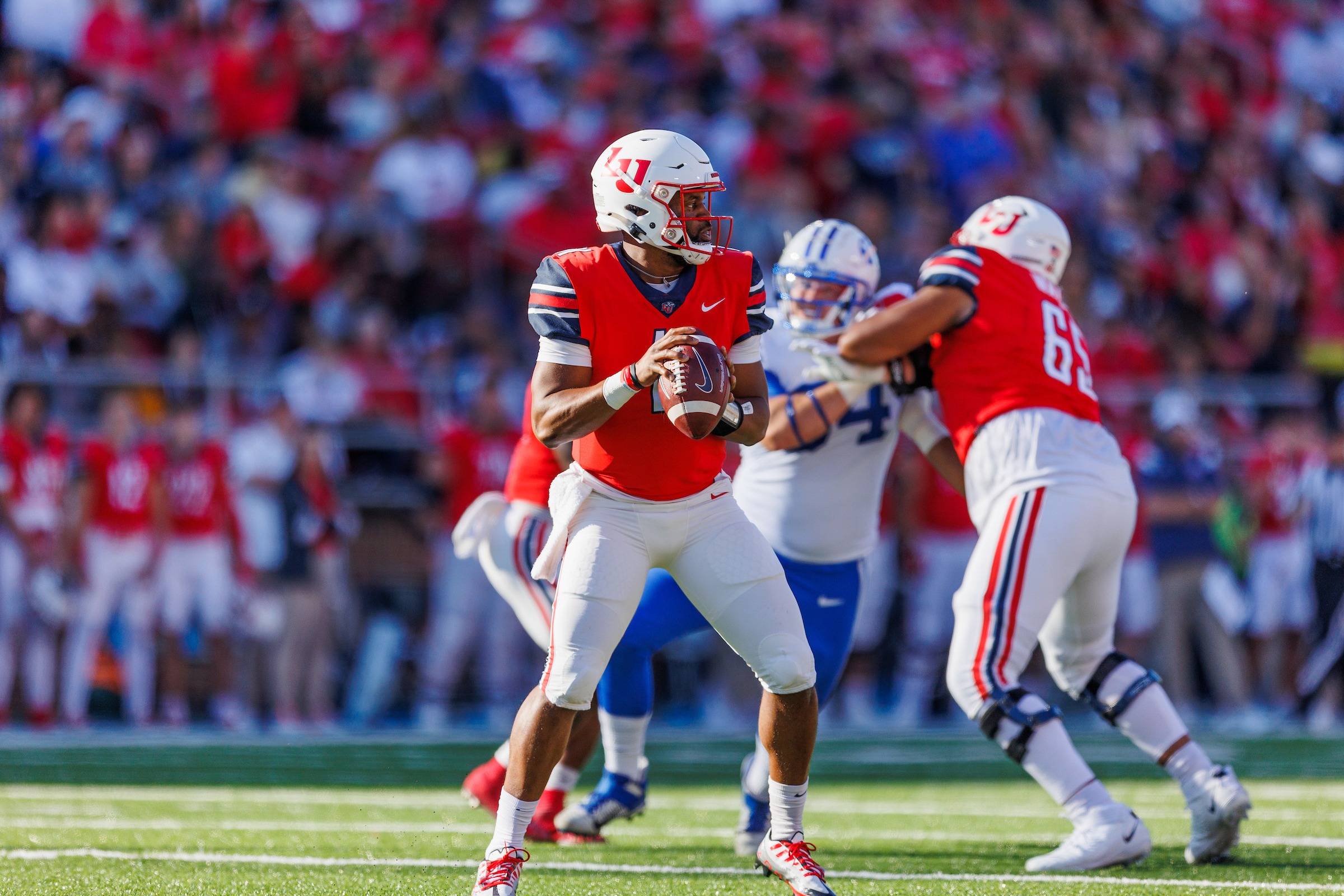 LU Football quarterback throwing a pass during the game