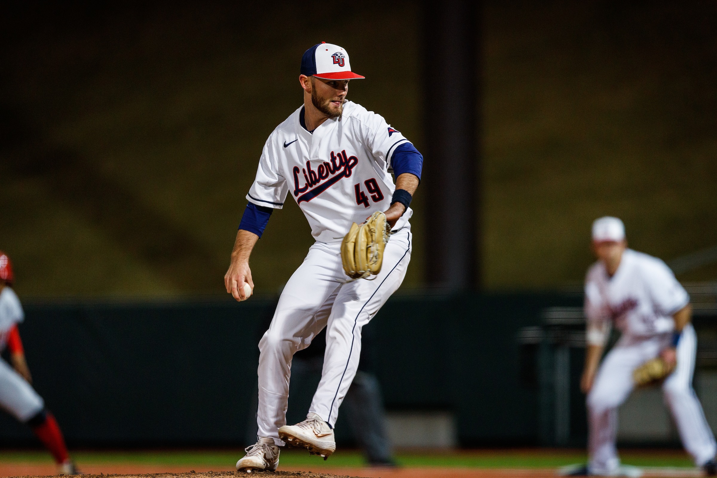 LU baseball pitcher throwing a pitch during the game