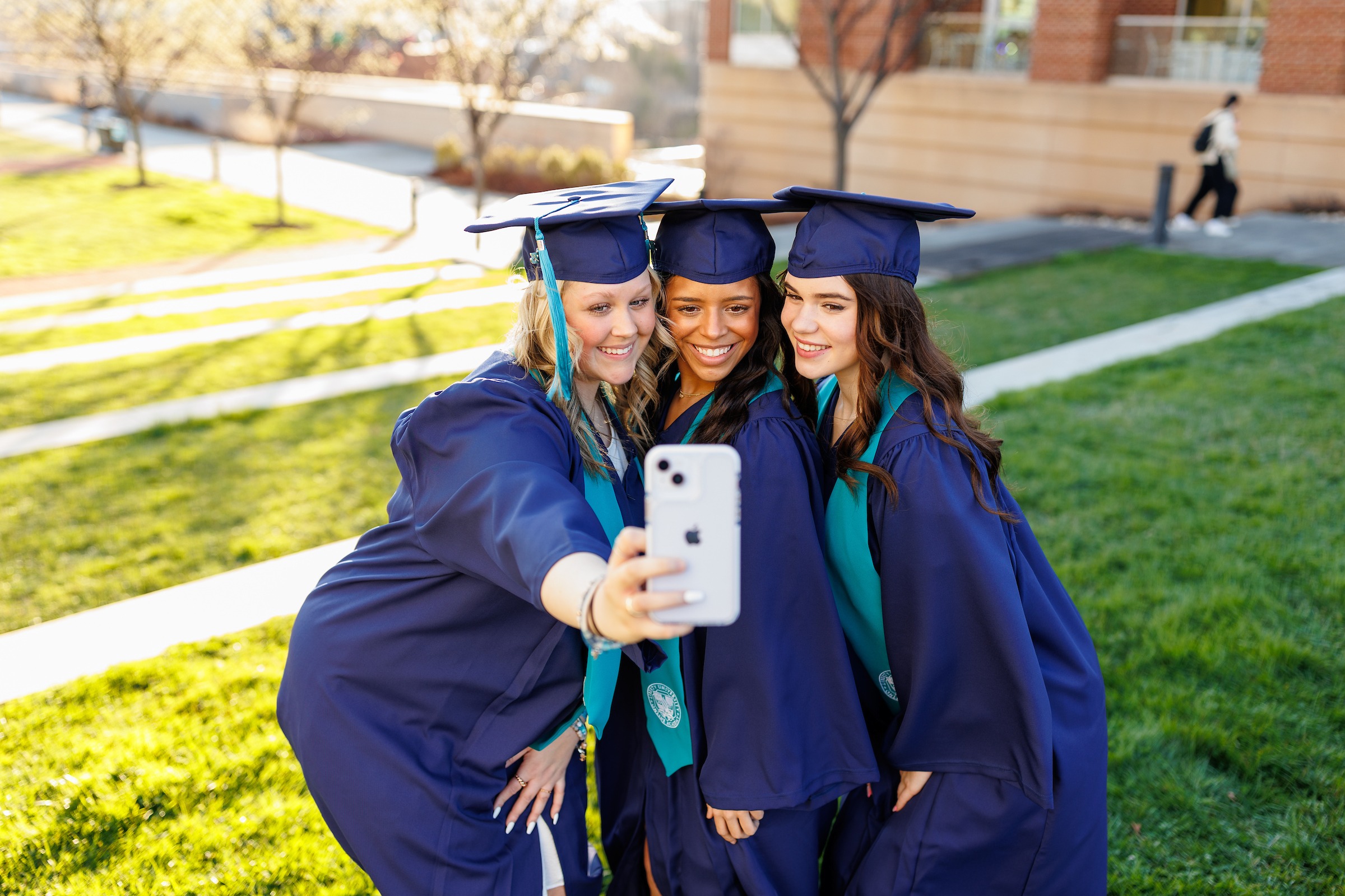 LUOA student at graduation taking a selfie