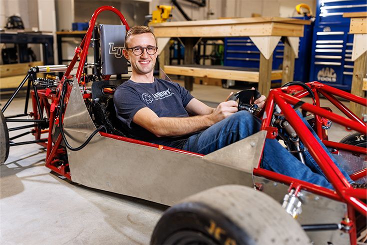 Student sitting in project car
