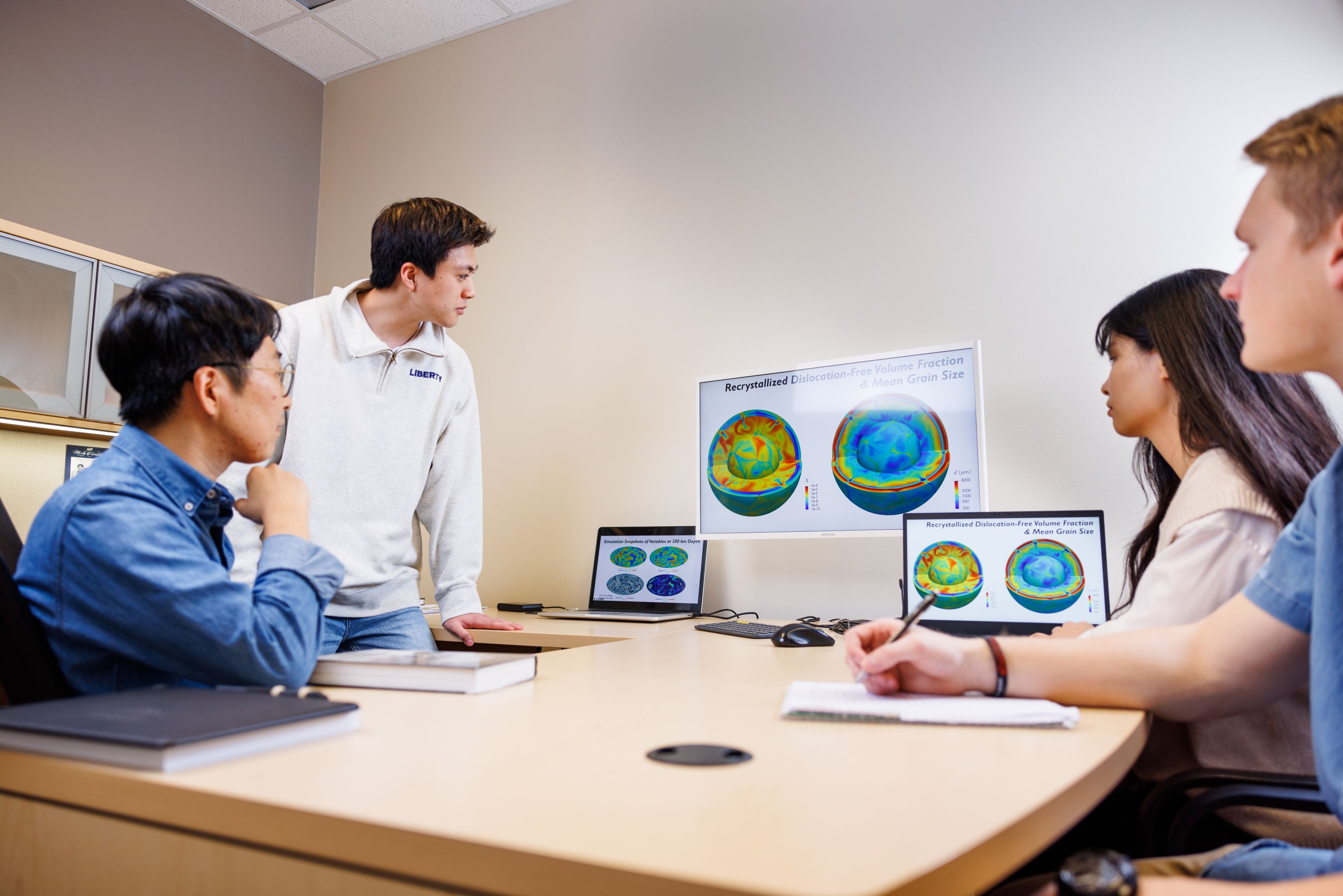 Engineering BS Students Collabrating With Professor